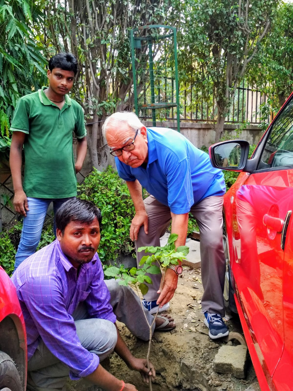 Mahendra Singh Plantmg a Tree outside his Socieity, Sagar Presidency.
